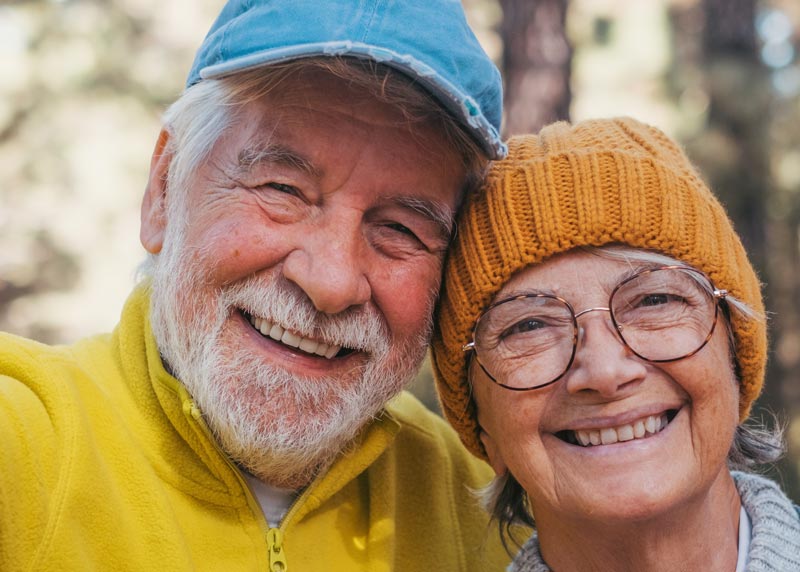 happy retired couple on a hike